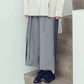 Pleated high-waisted trousers with one-sided pleat and tie-up detail (black/grey) Organic Cotton & Recycle