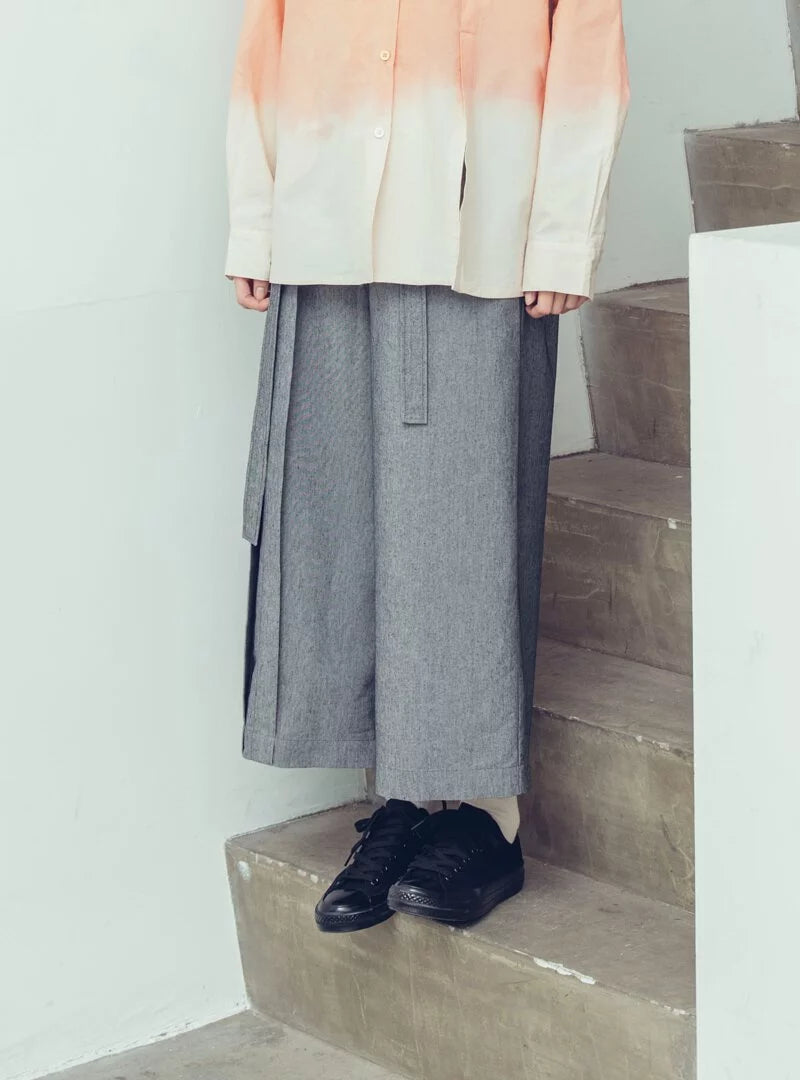 Pleated high-waisted trousers with one-sided pleat and tie-up detail (black/grey) Organic Cotton & Recycle