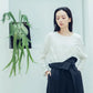 Pleated high-waisted trousers with one-sided pleat and tie-up detail (black/grey) Organic Cotton & Recycle